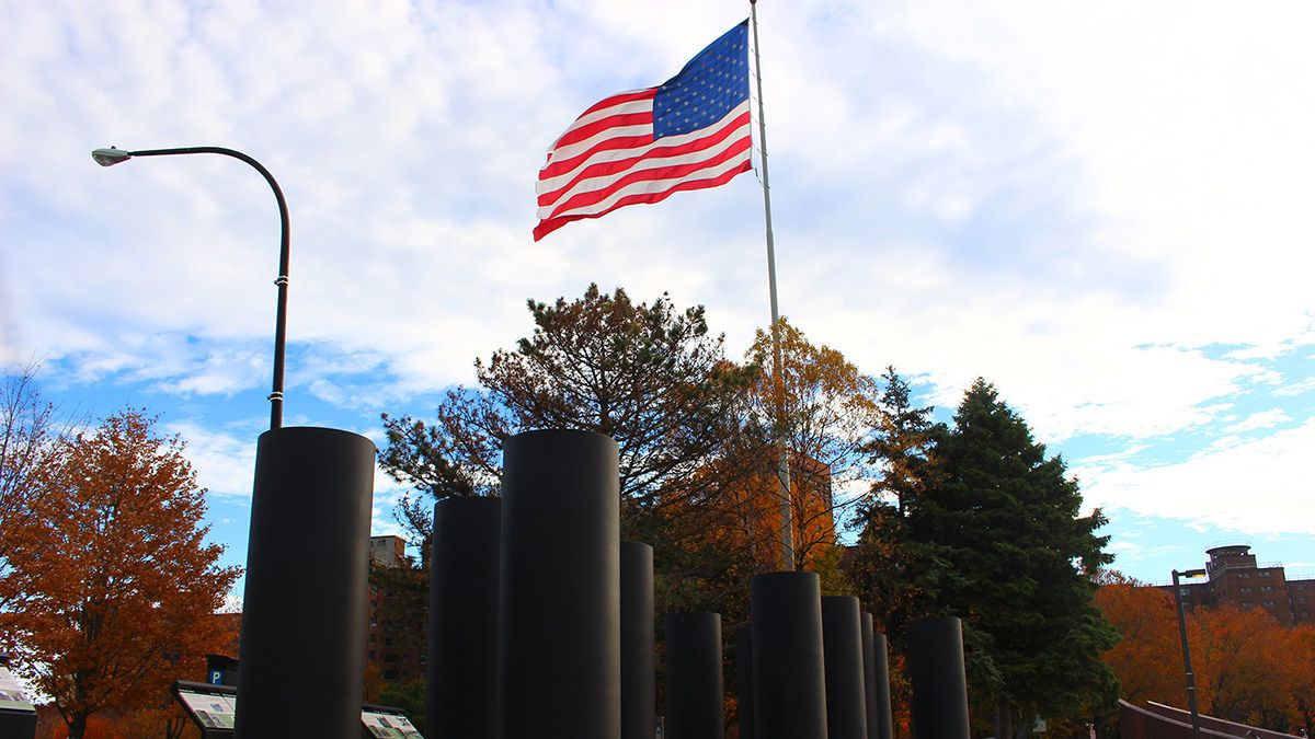 Pillars by an American flag